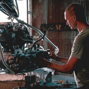 Mechanic building a motorcycle engine